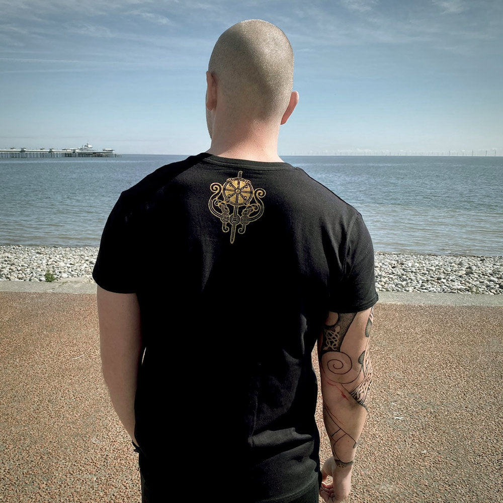 Mandala design inspired by the Viking Age printed in gold on a black shirt designed by Sacred Knot Tattoo